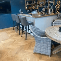 Herringbone flooring in a bar and hospitality dining area